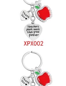 Detailed view of teacher appreciation keychain with red apple and engraved heart pendant