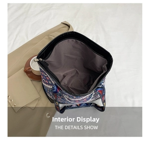 Detail showing the large interior capacity and zipper pocket of the ethnic tote bag