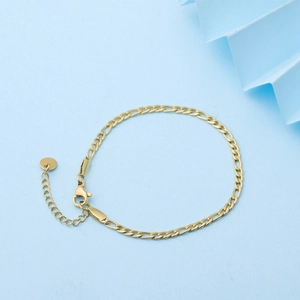 Detail of gold-plated stainless steel Figaro chain with lobster clasp and extension