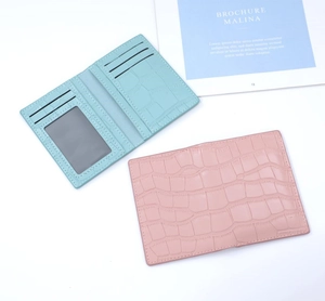 Detail of crocodile pattern card holders showing 3 card slots and 1 ID window