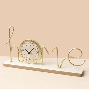 Minimalist home metal clock with gold wire design and wooden base for desk decor