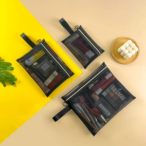 Three-piece set of black nylon mesh makeup bags in various sizes with handles and zippers