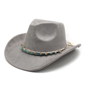 Detail of grey suede cowboy hat with turquoise beaded band and bohemian ethnic accents