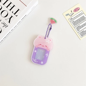 Detail of pink and purple cartoon pig magnetic acrylic frame with purple bead chain