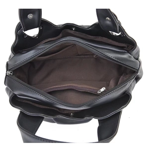 Top view showing multiple interior compartments and brown lining of the black leather handbag