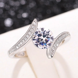 Elegant silver ring with a large round moissanite center stone and pavé band design