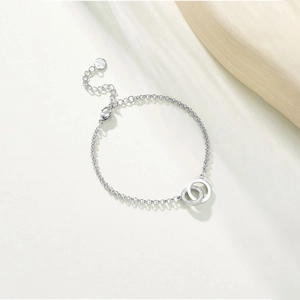 Detailed macro view of interlocking double rings bracelet with sparkling pavé crystals