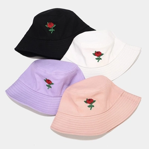 Set of four cotton bucket hats with red rose embroidery in black white purple and pink