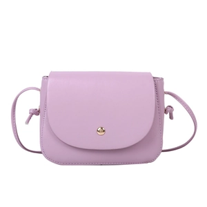 Minimalist purple leather crossbody bag with flap cover and golden circular magnetic buckle