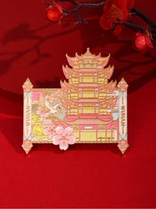 Detail of metal Wuhan Yellow Crane Tower fridge magnet with cherry blossoms and cranes