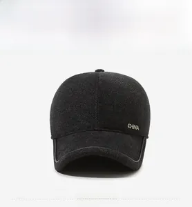 Macro shot of dark grey wool blend cap fabric with a metal CHINA logo detail