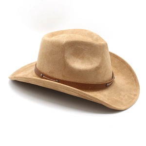 Detail of light khaki suede western cowboy hat with brown leather band and silver studs