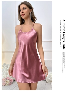 Pink satin slip dress detail showing smooth silk-like texture and delicate spaghetti straps