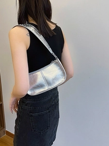 Metallic silver punk shoulder bag with rivets and glossy PU leather finish