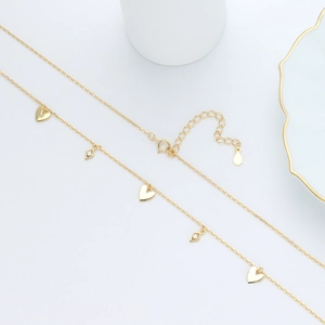 Elegant 925 sterling silver gold heart and diamond-shaped pendant necklace on white display