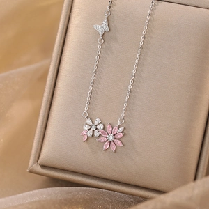 Elegant S925 silver necklace with pink and white floral pendants and butterfly charm