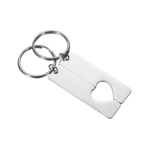 Polished stainless steel couple keychain set with interlocking heart cutout design