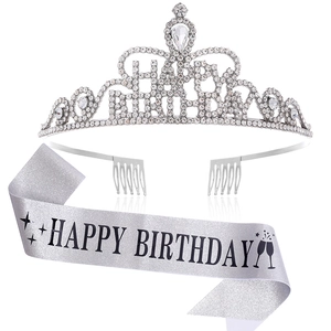 Detailed view of silver birthday tiara with rhinestones and glitter sash decoration