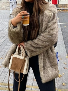 Elegant grey-brown faux fur long sleeve coat for women in autumn urban street style