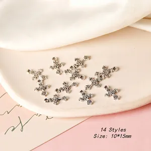 Macro detail of 10x15mm vintage silver cross charms for DIY jewelry making