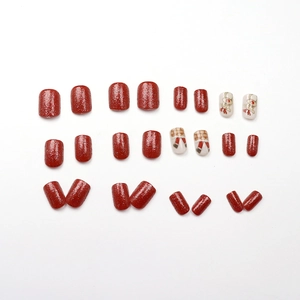 Festive red glitter press-on nails with cute Christmas bunny and reindeer holiday art