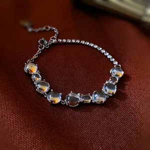 Elegant silver butterfly heart bracelet with synthetic cat-eye stones and tennis chain