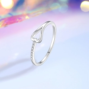Elegant S925 sterling silver heart open ring with side diamonds on a soft bokeh background