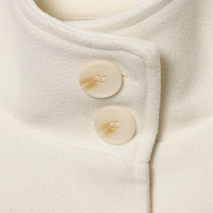 British style white wool cape coat featuring elegant collar detail and resin buttons