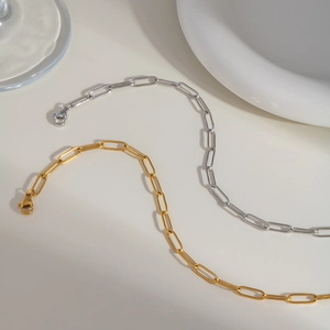 Detail of gold and silver paperclip link chain anklets with durable lobster clasp closures