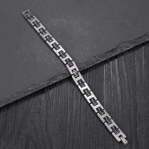 Vintage industrial men's bracelet with brushed stainless steel and black silicone links
