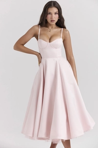 Detail of elegant pink French tulle dress showing delicate straps and heart-shaped neckline
