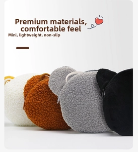 Close-up of small plush bear shoulder bags in four colors with soft fleece texture