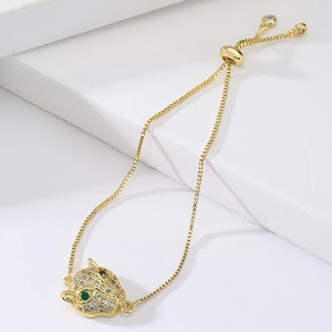 Gold-plated leopard head bracelet with white and green sparkling cubic zirconia stones