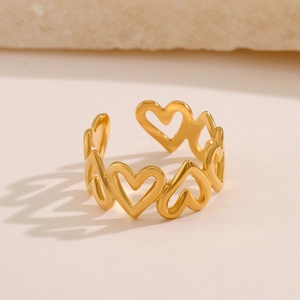 Bague ouverte en acier inoxydable plaqué or 18 carats avec cœurs évidés sur pierre