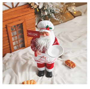 Detailed top view of a Santa chef figure with a Welcome sign and festive kitchen props
