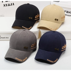 Detail of baseball caps in four colors featuring Chinese Dream gold embroidery