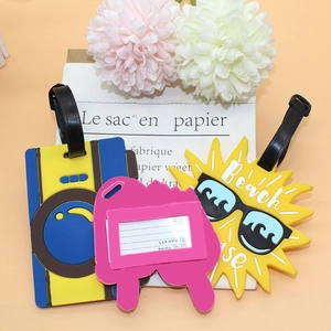 Cartoon fruit and camera PVC luggage tags with information cards on a soft orange background