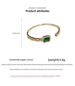 Detail view of gold emerald zircon bracelet featuring 9.8g copper and cubic zirconia specs