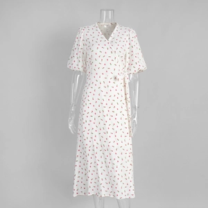 Detail of white cotton wrap dress with pink tulip floral print and puffed short sleeves
