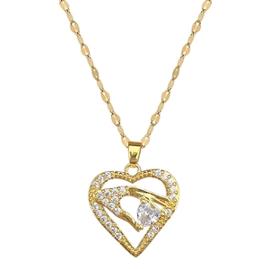 Luxurious gold heart pendant necklace with shimmering crystals on a sleek link chain