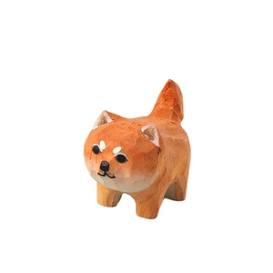Handcrafted orange wooden shiba inu puppy figurine with natural wood grain for desk decor