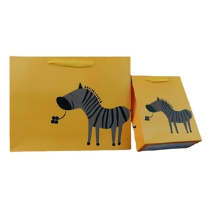 Minimalist yellow paper gift bags with cute cartoon zebra and handles for shopping