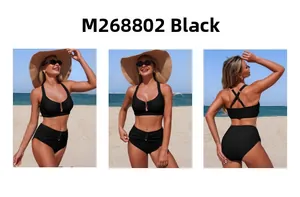 Detail of black halter bikini set with golden ring accent and high waisted ruched bottoms