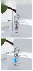 Detailed view of teardrop zircon earrings with measurements 2.05cm length and pavé ring
