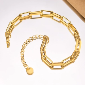 Polished gold paperclip chain bracelet for men with round pendant and extender on white base