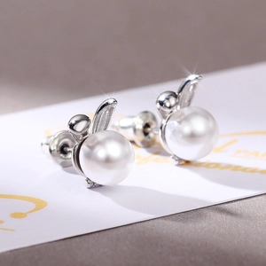 Cute silver rabbit ear stud earrings with white pearls for a minimalist fashion look