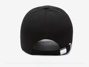 Close-up of black baseball cap back with adjustable strap and silver metal buckle