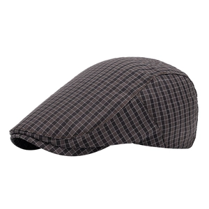 Classic brown and black checkered flat cap with retro British style for outdoor use