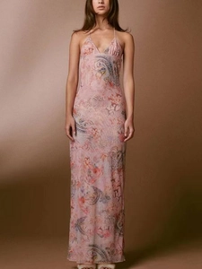 Detail of a slim-fit mesh maxi dress with vintage pink butterfly floral print patterns
