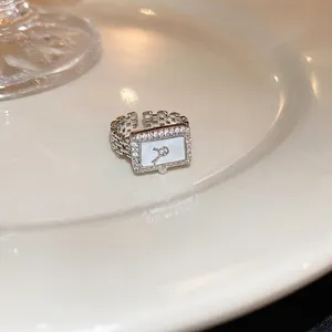 Gold plated square watch chain ring with white mother of pearl and cubic zirconia